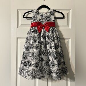 Fancy black and white dress with sparkles and red bow